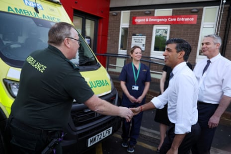 Rishi Sunak shaking hands with an ambulance driver during a visit to the University Hospital of North Tees this morning.