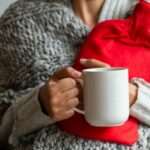 woman holding hot water bottle