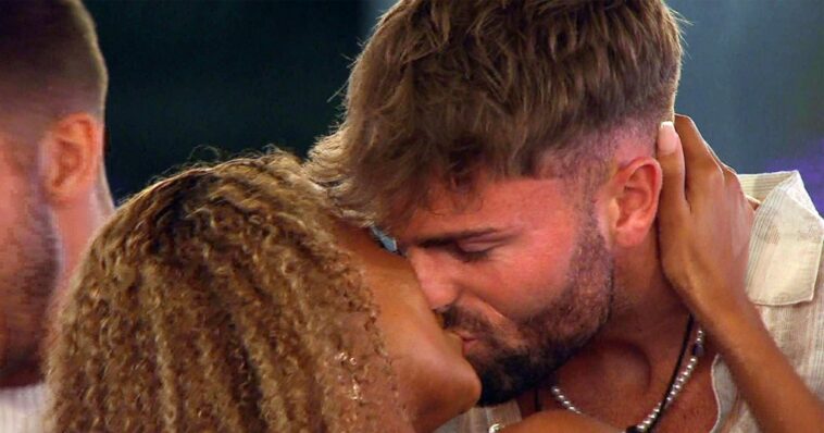 Love island stars Tom and Zara making out.
