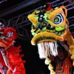 Two red and yellow Chinese dragons during a Chinese New Year celebration at Birmingham Hippodrome.