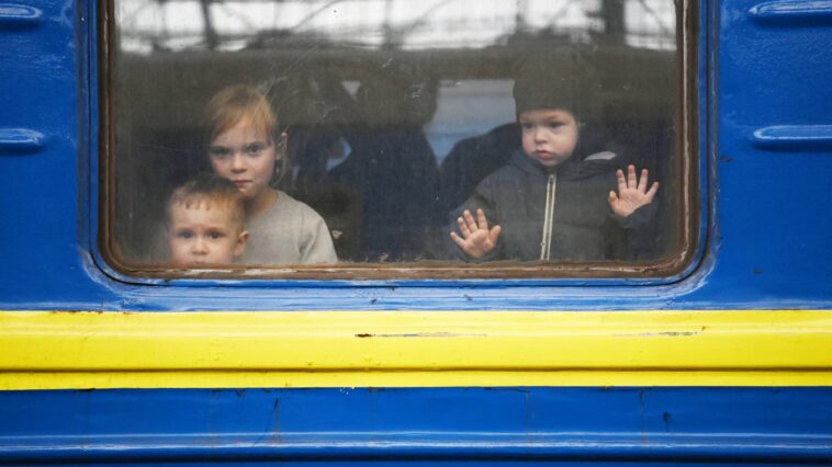 Haunting photos show a year of Russia's war in Ukraine