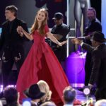 LOS ANGELES, CALIFORNIA - FEBRUARY 26: Jessica Chastain (C) accepts the Outstanding Performance by a Female Actor in a Television Movie or Limited Series award for