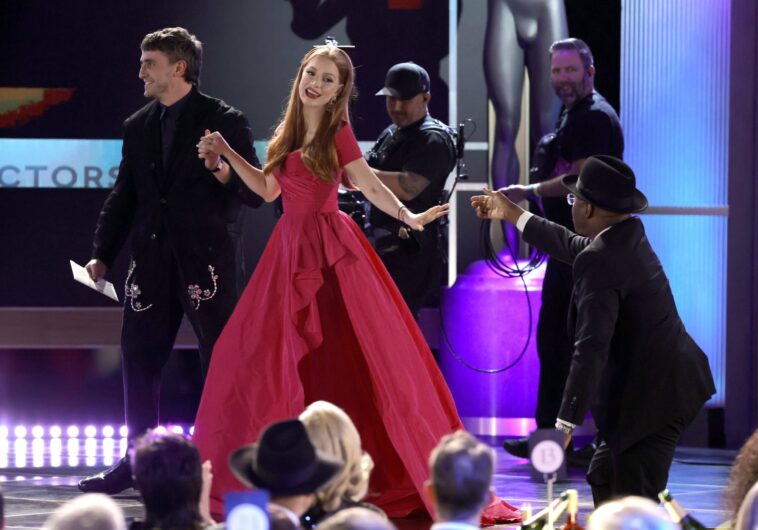 LOS ANGELES, CALIFORNIA - FEBRUARY 26: Jessica Chastain (C) accepts the Outstanding Performance by a Female Actor in a Television Movie or Limited Series award for