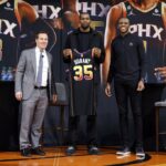 (L-R) Owner Mat Ishbia, Kevin Durant and general manager James Jones of the Phoenix Suns pose for a photo at a press conference at Footprint Center on February 16,