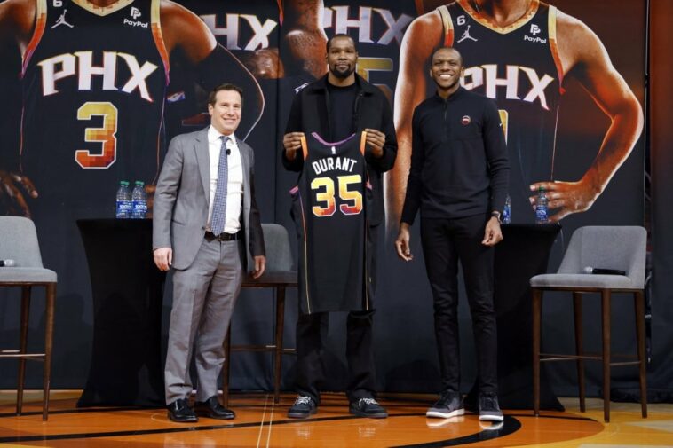 (L-R) Owner Mat Ishbia, Kevin Durant and general manager James Jones of the Phoenix Suns pose for a photo at a press conference at Footprint Center on February 16,