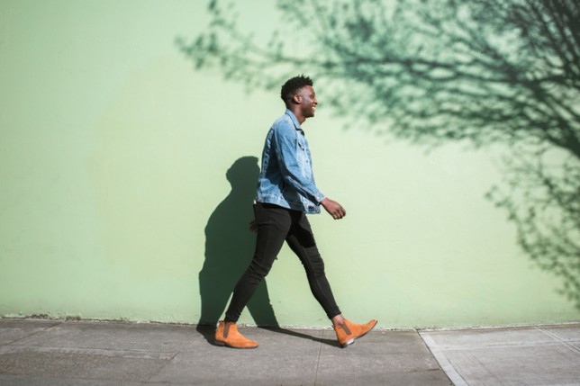 man walking on pavement