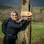 Lady in hjiab with sign