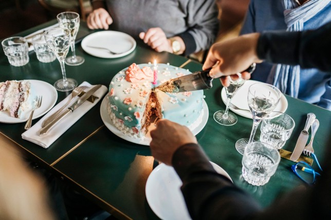 Birthday Cake Being Served In Restaurant