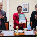 Subhash Nepali (left) and colleagues mark the release of the Least Developed Country Report (2019) for Nepal.