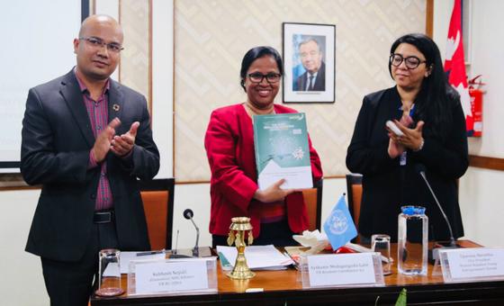 Subhash Nepali (left) and colleagues mark the release of the Least Developed Country Report (2019) for Nepal.