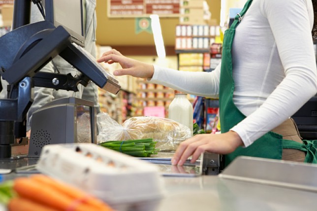 Cashier ringing up groceries