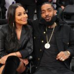 LOS ANGELES, CALIFORNIA - NOVEMBER 14: Nipsey Hussle and Lauren London attend a basketball game between the Los Angeles Lakers and the Portland Trail Blazers  at Staples Center on November 14, 2018 in Los Angeles, California. (Photo by Allen Berezovsky/Getty Images)