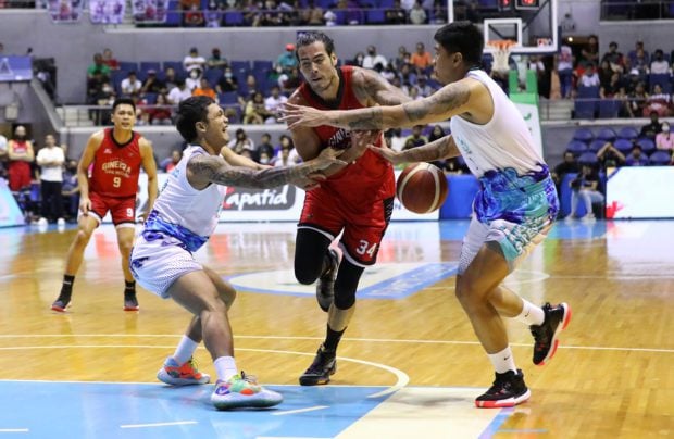 Ginebra big man Christian Standhardinger against Phoenix defenders. –PBA IMAGES