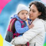 woman holding child on colourful background