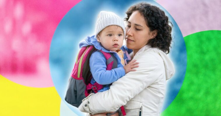 woman holding child on colourful background