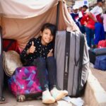 A Venezuelan girl waits at a reception centre in Pacaraima, a city in northern Brazil that lies across the Venezuelan border.