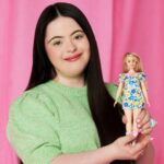 British model Ellie Goldstein poses with Barbie's first doll with Down's syndrome