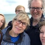 Jules Middleton with her family, including her dad, by the sea.