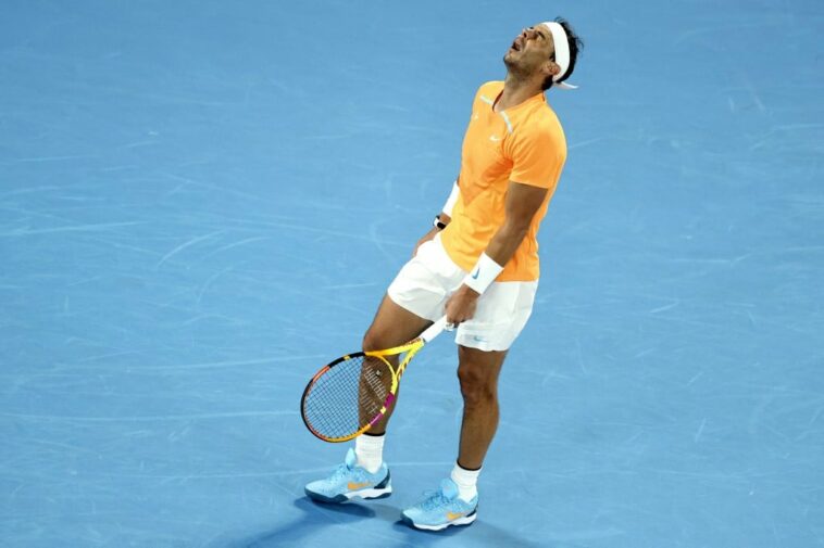 (FILES) In this file photo taken on January 18, 2023 Spain's Rafael Nadal reacts as he competes against Mackenzie McDonald of the US during his men's singles match on day three of the Australian Open tennis tournament in Melbourne.