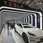 Tesla net income drops more than 20% from last year