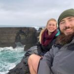 PIC FROM Kennedy News and Media (PICTURED: CHARLOTTE BROOK, 25, FROM STRACHUR, SCOTLAND, AND DANIEL MCNEIL, 27, FROM DUMFRIES, SCOTLAND, WHO MET WHILE DANIEL WAS HIKING THE ENTIRE COAST OF THE UK FOR CHARITY IN SHETLAND) A waitress met the man of her dreams while he was hiking the entire coast of the UK - so quit her job to join him on the epic walk and sleep in tents and garden sheds. Charlotte Brook, 25, had been working in a restaurant in Strachur, Scotland, in May 2019 when a friend introduced her to Daniel McNeil. Veteran Daniel, 27, had started hiking the entire coast of the UK two months earlier and needed advice from a local on where he could pitch his tent. DISCLAIMER: While Kennedy News and Media uses its best endeavours to establish the copyright and authenticity of all pictures supplied, it accepts no liability for any damage, loss or legal action caused by the use of images supplied and the publication of images is solely at your discretion. SEE KENNEDY NEWS COPY - 0161 697 4266