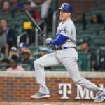 May 22, 2023; Atlanta, Georgia, USA; Los Angeles Dodgers first baseman Freddie Freeman (5) hits a single against the Atlanta Braves in the ninth inning at Truist Park.