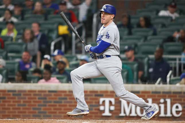 May 22, 2023; Atlanta, Georgia, USA; Los Angeles Dodgers first baseman Freddie Freeman (5) hits a single against the Atlanta Braves in the ninth inning at Truist Park.