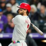 May 12, 2023; Denver, Colorado, USA; Philadelphia Phillies designated hitter Bryce Harper (3) doubles in the seventh inning against the Colorado Rockies at Coors Field.