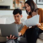 Young couple looking at laptop