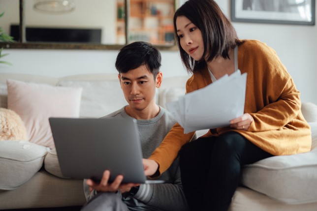 Young couple looking at laptop