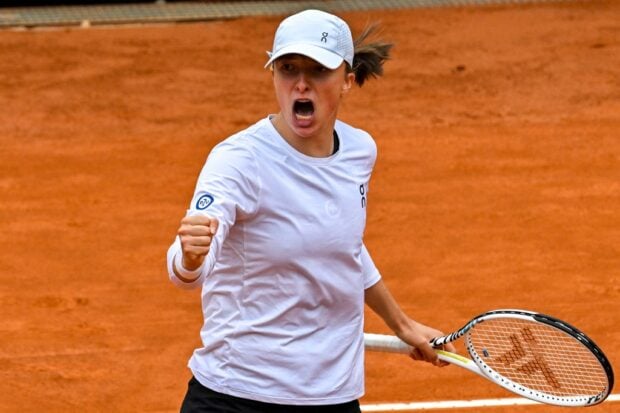 Poland's Iga Swiatek celebrates after defeating Croatia's Donna Vekic in their round of 16 match of the Women's WTA Rome Open tennis tournament on May 16, 2023 at Foro Italico in Rome.