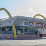 Customers order food at the oldest operating McDonald's Corp. restaurant on Monday, April 27, 2020. McDonald's is cutting capital expenditures and suspending buybacks as the coronavirus pandemic gnawed at sales. Photographer: Kyle Grillot/Bloomberg via Getty Images