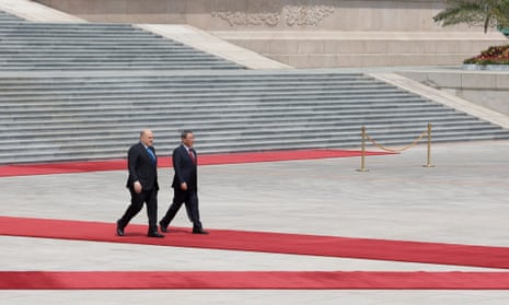 Russian Prime Minister Mikhail Mishustin (L) and Chinese Premier Li Qiang attend a welcoming ceremony in Beijing, China, 24 May 2023.