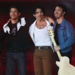 ARLINGTON, TEXAS - NOVEMBER 24: Nick Jonas, Joe Jonas, and Kevin Jonas of the Jonas Brothers perform in the halftime show during the game between the Dallas Cowboys and the New York Giants at AT&T Stadium on November 24, 2022 in Arlington, Texas. (Photo by Richard Rodriguez/Getty Images)