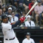 May 30, 2023; Chicago, Illinois, USA; Chicago White Sox designated hitter Eloy Jimenez (74) hits an RBI sacrifice fly against the Los Angeles Angels during the first inning at Guaranteed Rate Field.