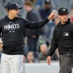 May 25, 2023; Bronx, New York, USA; New York Yankees manager Aaron Boone (17) argues with first base umpire Chris Guccione (68) during the third inning against the Baltimore Orioles at Yankee Stadium.