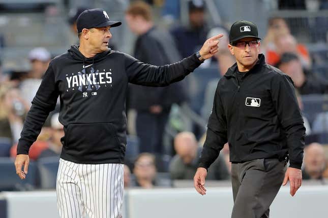 May 25, 2023; Bronx, New York, USA; New York Yankees manager Aaron Boone (17) argues with first base umpire Chris Guccione (68) during the third inning against the Baltimore Orioles at Yankee Stadium.