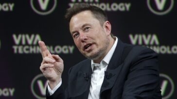 Elon Musk says Tesla's market cap is directly tied to whether it solves autonomous driving