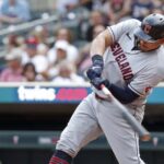 Jun 4, 2023; Minneapolis, Minnesota, USA; Cleveland Guardians designated hitter Josh Naylor (22) hits an RBI double against the Minnesota Twins in the seventh inning at Target Field.