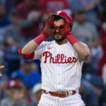 Jun 9, 2023; Philadelphia, Pennsylvania, USA; Philadelphia Phillies left fielder Kyle Schwarber (12) reacts after hitting a triple during the third inning against the Los Angeles Dodgers at Citizens Bank Park.