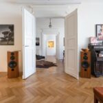 Interior of living room with open doors to next room