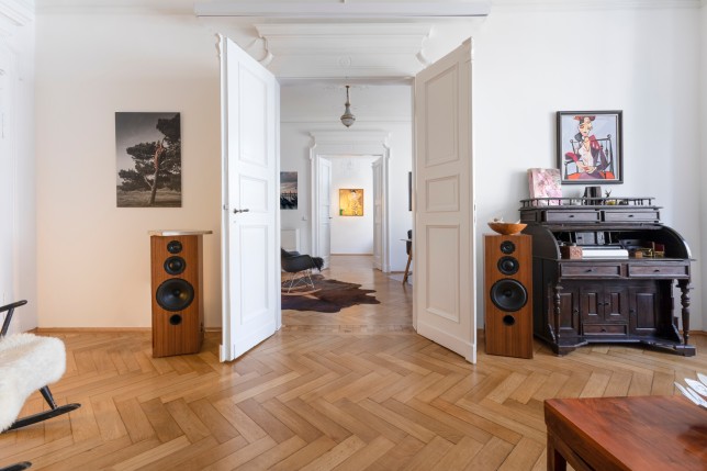 Interior of living room with open doors to next room