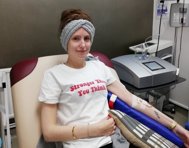 Vicky Hamlin in hospital, in a hospital chair with drips in her arm and machinery around her.