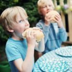 Children eating burgers