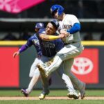 Jul 2, 2023; Seattle, Washington, USA; Tampa Bay Rays third baseman Isaac Paredes (17) collides with Seattle Mariners first baseman Ty France (23) while attempting to field a ground ball during the third inning at T-Mobile Park.