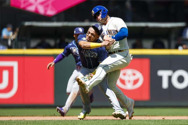 Jul 2, 2023; Seattle, Washington, USA; Tampa Bay Rays third baseman Isaac Paredes (17) collides with Seattle Mariners first baseman Ty France (23) while attempting to field a ground ball during the third inning at T-Mobile Park.