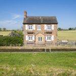 BNPS.co.uk (01202) 558833. Pic: FisherGerman/BNPS Homebuyers can go off-grid with this lock keeper's cottage and narrowboat - on the market for ??400,000. Grade II Listed Deep Lock Cottage would be the ideal weekend bolthole - it has no access for cars and can only be reached on foot by the canal towpath or by boat. The two-bedroom house has a 64ft mooring and the sale includes the current owner's 33ft narrowboat, which can provide extra guest accommodation and be used to collect shopping and run errands. The quirky property sits alongside the Oxford Canal, near the village of Somerton, with far-reaching views of the idyllic countryside.