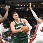 Apr 26, 2023; Milwaukee, Wisconsin, USA; Milwaukee Bucks center Brook Lopez (11) drives against Miami Heat during game five of the 2023 NBA Playoffs at Fiserv Forum.