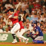 Jul 6, 2023; Boston, Massachusetts, USA; Boston Red Sox left fielder Rob Refsnyder (30) hits a single to center field to drive in a run against the Texas Rangers in the sixth inning at Fenway Park.