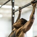 wmona doing pull-ups/Gym